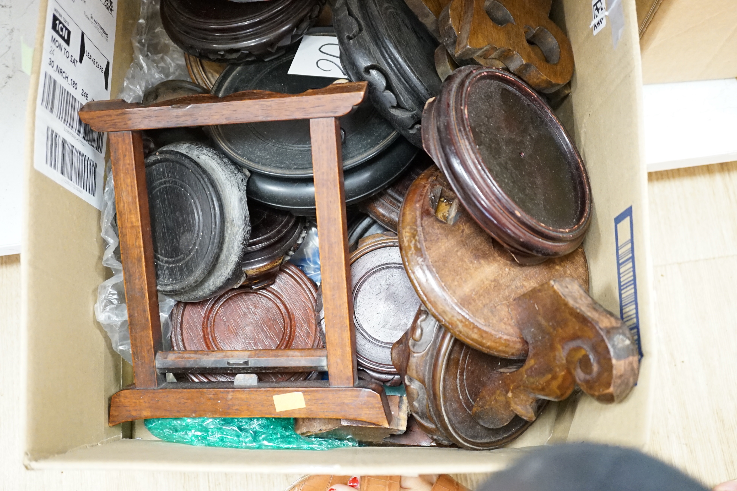 Chinese carved hardwood stands including some with pierced decoration, the largest 15cm in diameter